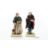 A PAIR OF 19TH CENTURY NAPLES PORCELAIN FIGURES OF PAUPERS wearing tattered clothes,