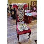 A VICTORIAN WALNUT PRIE DIEU CHAIR upholstered in floral beadwork, barley-twist columns,