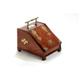 A UNUSUAL LATE VICTORIAN OAK SCUTTLE-SHAPED TEA CADDY with brass strap hinges, mounts and handle,