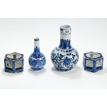 A CHINESE BLUE & WHITE PORCELAIN BOTTLE VASE decorated with trailing flowers & lappets,