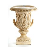 A DECORATIVE FAUX MARBLE CAMPANA SHAPED URN decorated with classical figures,