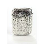 A LARGE LATE VICTORIAN SILVER FLIP TOP VESTA CASE with leaf engraved decoration, maker: WJ,