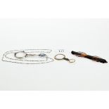 A PAIR OF CONTINENTAL WHITE METAL LORGNETTES with embossed blue faceted stone set handle,