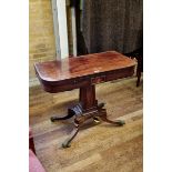 A REGENCY PERIOD MAHOGANY "D" SHAPED CARD TABLE, the ebony strung top above a panel centre frieze,