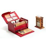 AN EARLY 20TH CENTURY RED MOROCCO LEATHER COVERED "RUBICON BEZIQUE" SET with internal cards,