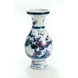 A CHINESE PORCELAIN BALUSTER SHAPED VASE with flared rim decorated with green enamel trees &