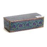 A 19TH CENTURY MIDDLE EASTERN gilded copper and Champleve enamel rectangular BOX, 18.5 x 8cms.