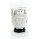 A CHINESE FUJIAN STYLE WHITE GLAZED PORCELAIN VASE decorated with raised seated Immortals and