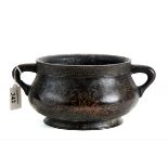 AN ORIENTAL BRONZE CENSER of compressed circular form with inlaid stylised bird and scroll