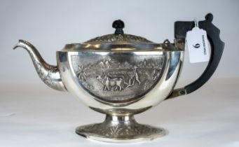 An Indian silver teapot decorated with rural & river scenes, 20 troy ounces, marked sterling TS,