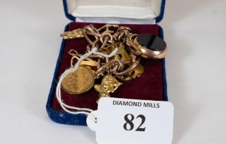 A Gold charm bracelet including 1914 half sovereign with 12 charms, 50gms, est. £700 - £800