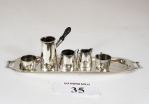 An Edwardian miniature six piece silver tea set comprising double handled tray, coffee pot, sugar