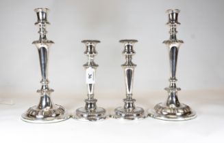 A large pair of 19th century Sheffield-plated candlesticks, 30cms and a similar smaller pair, 21.