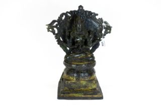 A Sino-Tibetan bronze figure of a six armed deity on a lotus leaf stepped base, 34cms, £100 - £200