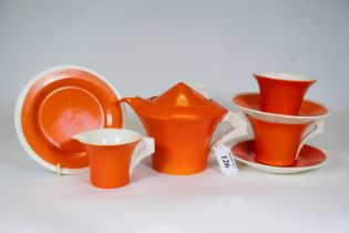 An unusual Clarice Cliff part tea set in orange & white comprising a teapot, cream jug, sugar basin,
