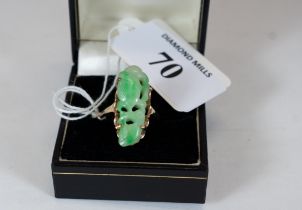 A 14K gold & carved apple green jade ring, size P, not marked but tests 14K, est £100 - £150