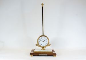 Thwaites & Reed, London, a reproduction limited edition gravity clock with white enamel dial, and