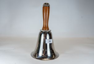 A novelty Art Deco style chrome bell shaped cocktail shaker with a turned wooden handle, 28cms high,