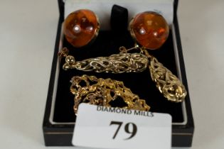 A pair of 9ct gold mounted amber earrings, a pair of 14ct gold pierced drop earrings (3.1gms), and