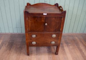 A George III mahogany tray top commode, the galleried top above a pair boxwood inlaid doors with