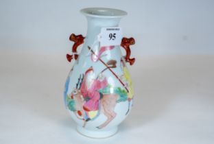 A Chinese porcelain pear shaped vase, twin side handles, polychrome decorated with a figure riding a