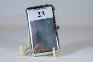 A Russian white metal rectangular purse with red cabochon stone set clasp, stamped 84/875, and