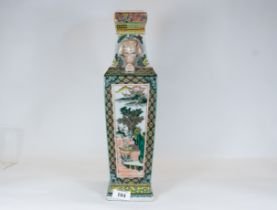 A Chinese famille verte porcelain vase decorated in the Kang Hsi style with panels of warriors,