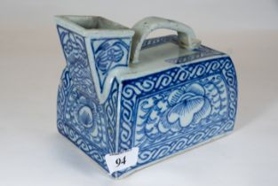 An unusual 19th century Chinese blue & white porcelain vessel of rectangular form with strap