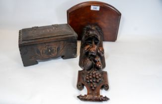 A Victorian carved mahogany fruiting lion mask wall bracket, 40cms high (adapted), and a carved