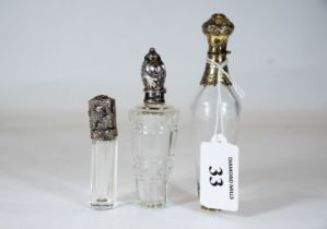 A Continental silver-gilt mounted scent flask with embossed & engraved mounts, 12cms and two