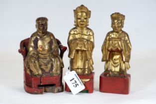 A 19th century Chinese carved & lacquered wooden figure of a seated dignitary, 14cms high and two