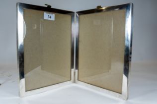 A large sterling silver folding double photograph frame, 26x42cms, approx 8oz, est £120 - £180