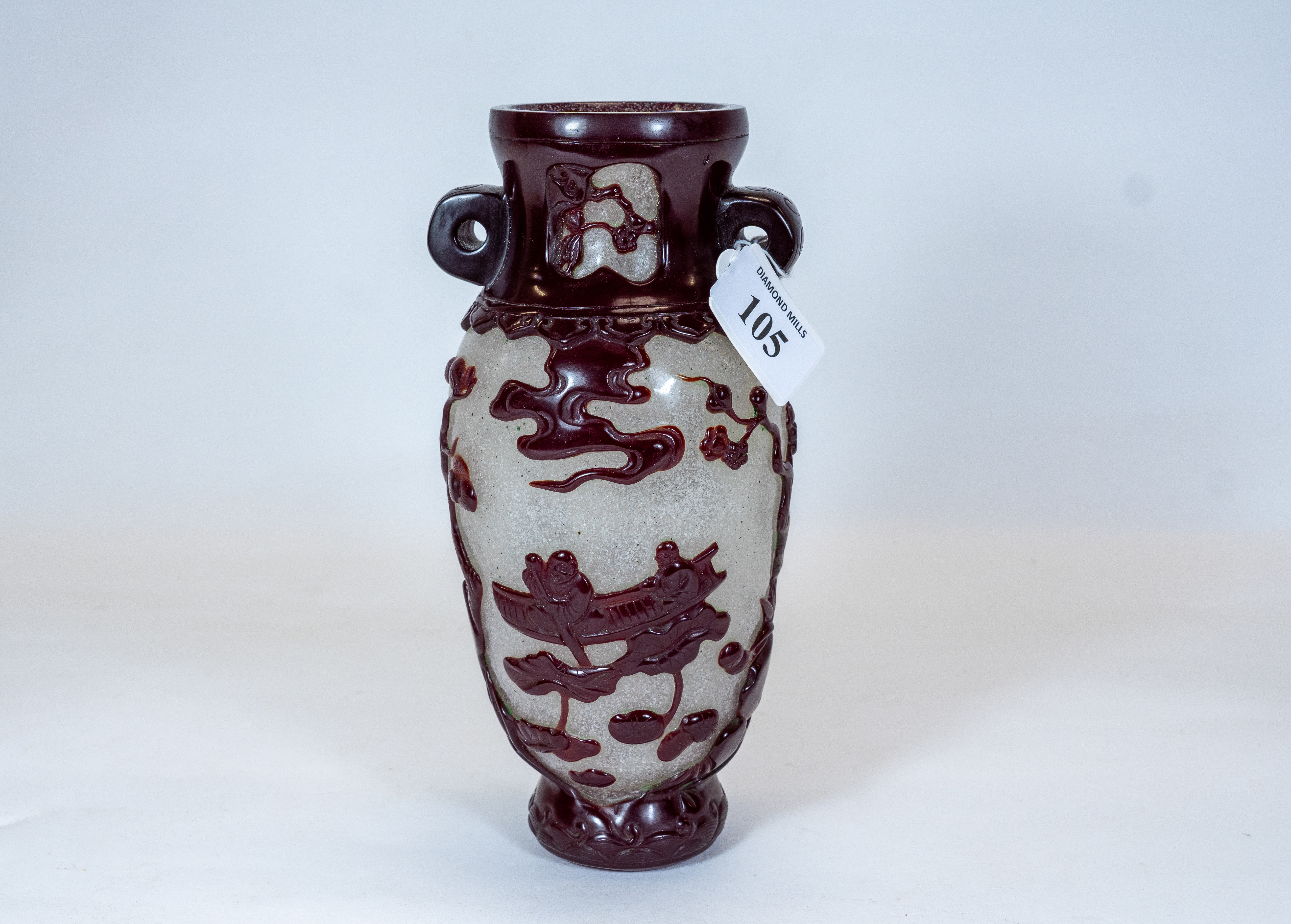 a 20th century Chinese peking carved glass vase, the speckled glass ground with red overlaid figures