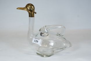 A 20th century glass duck form claret jug, stylised wing handles, the gilded brass spout stamped