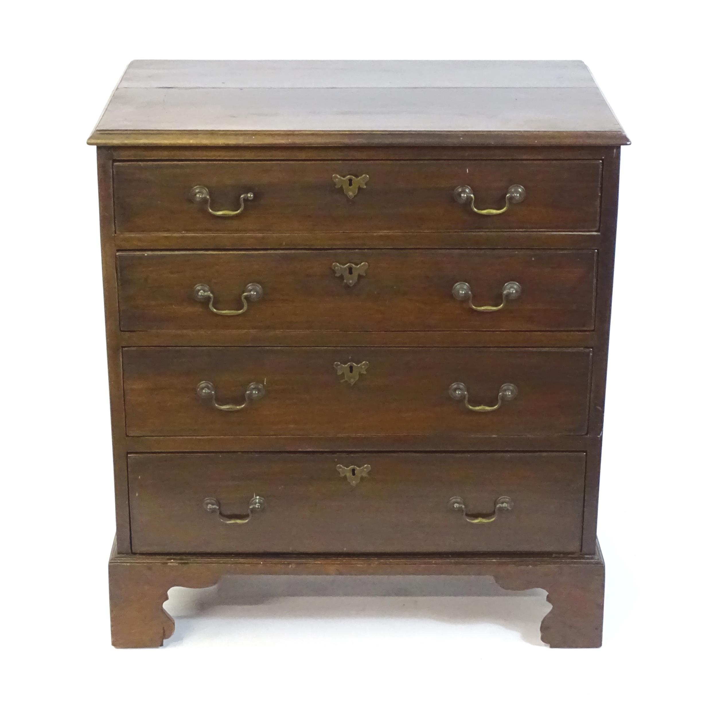 A late Georgian mahogany chest of drawers, having a rectangular moulded top above four long - Image 4 of 6