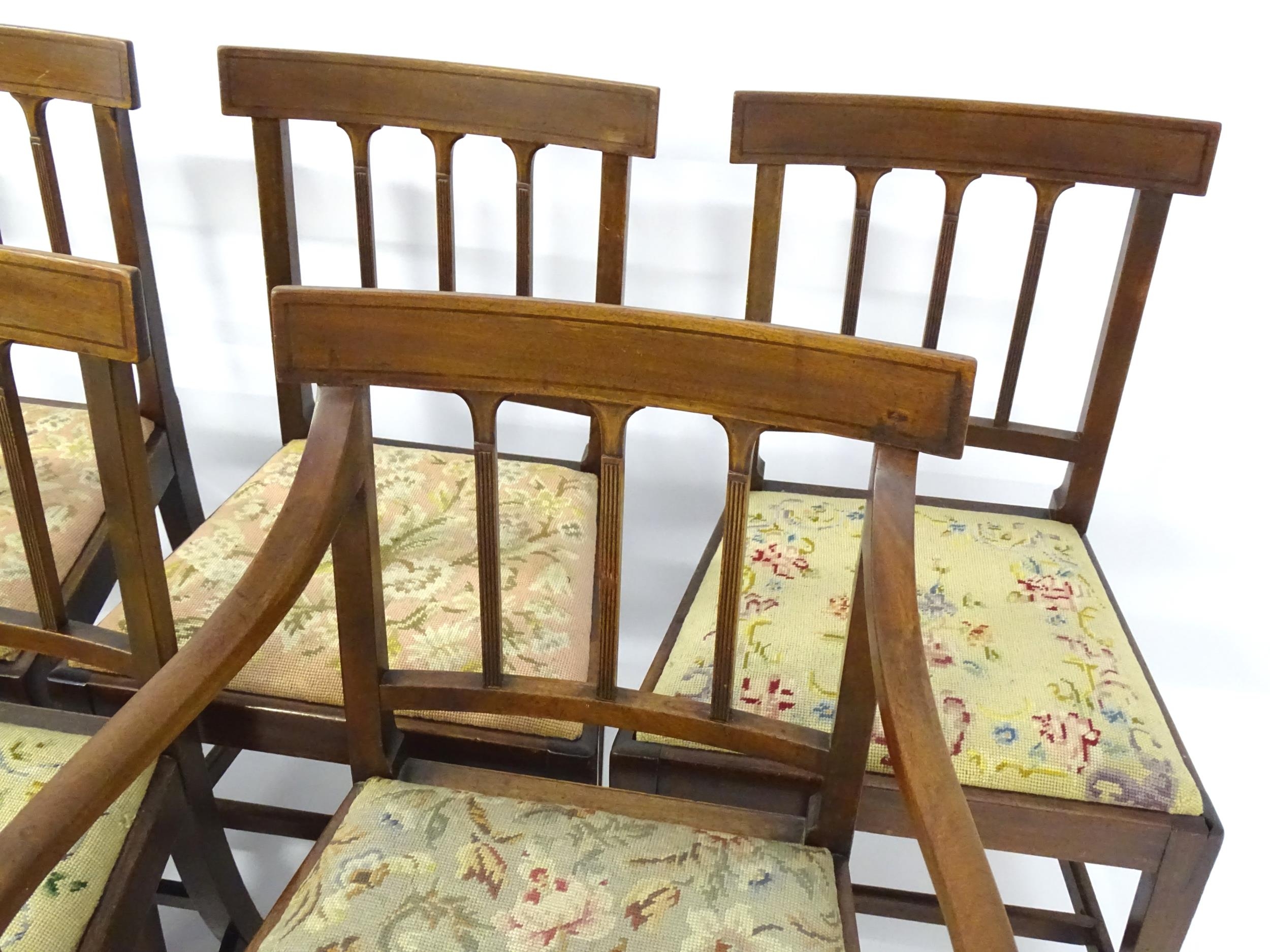 A set of eight Georgian mahogany dining chairs, having inlaid top rails above reeded back splats and - Image 7 of 12