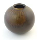 A Japanese vase of globular form with a drip glaze. Approx. 10 3/4" high Please Note - we do not