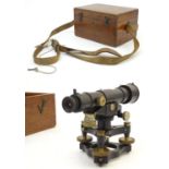 A surveyor's level theodolite by Cooke Troughton and Simms in original fitted box with instruction