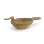 A Scandinavian folk art treen bowl / ale / grain measure modelled as a duck with banded geometric