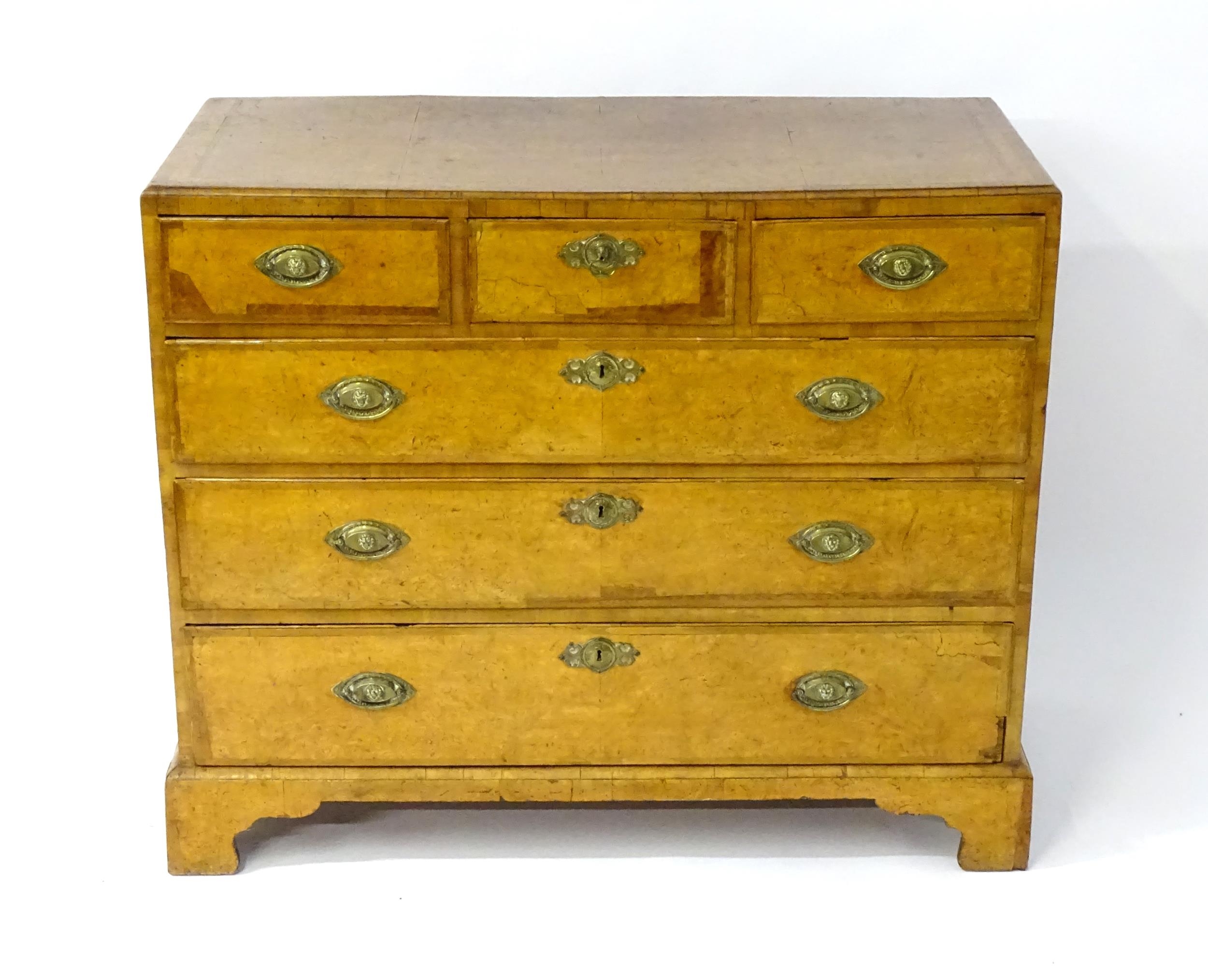 A George III walnut chest of drawers, the chest having a crossbanded top above three short over - Image 6 of 12