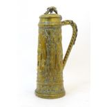 A late 19 / early 20thC large German brass stein with embossed decoration depicting Pipino,