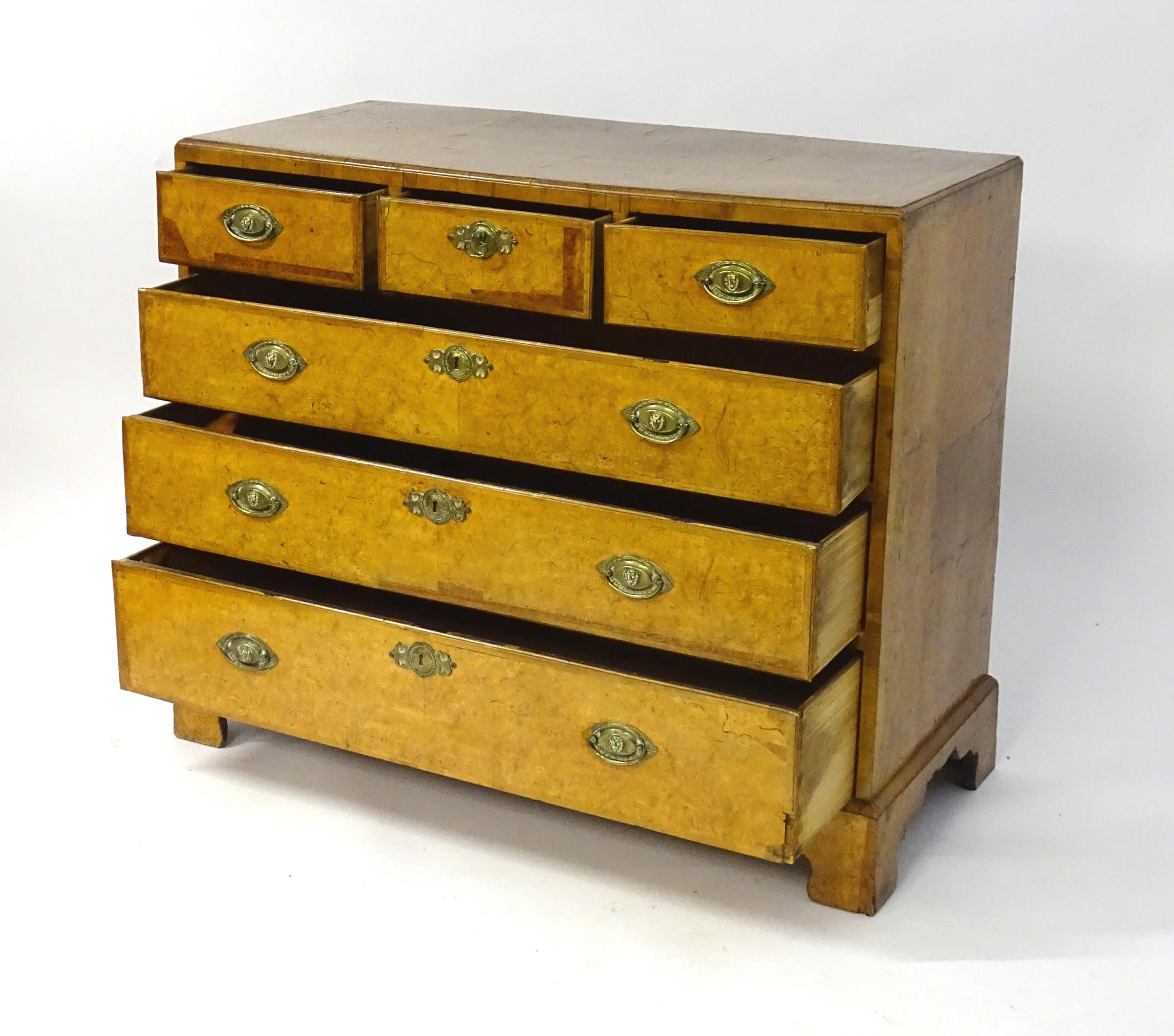 A George III walnut chest of drawers, the chest having a crossbanded top above three short over - Image 10 of 12