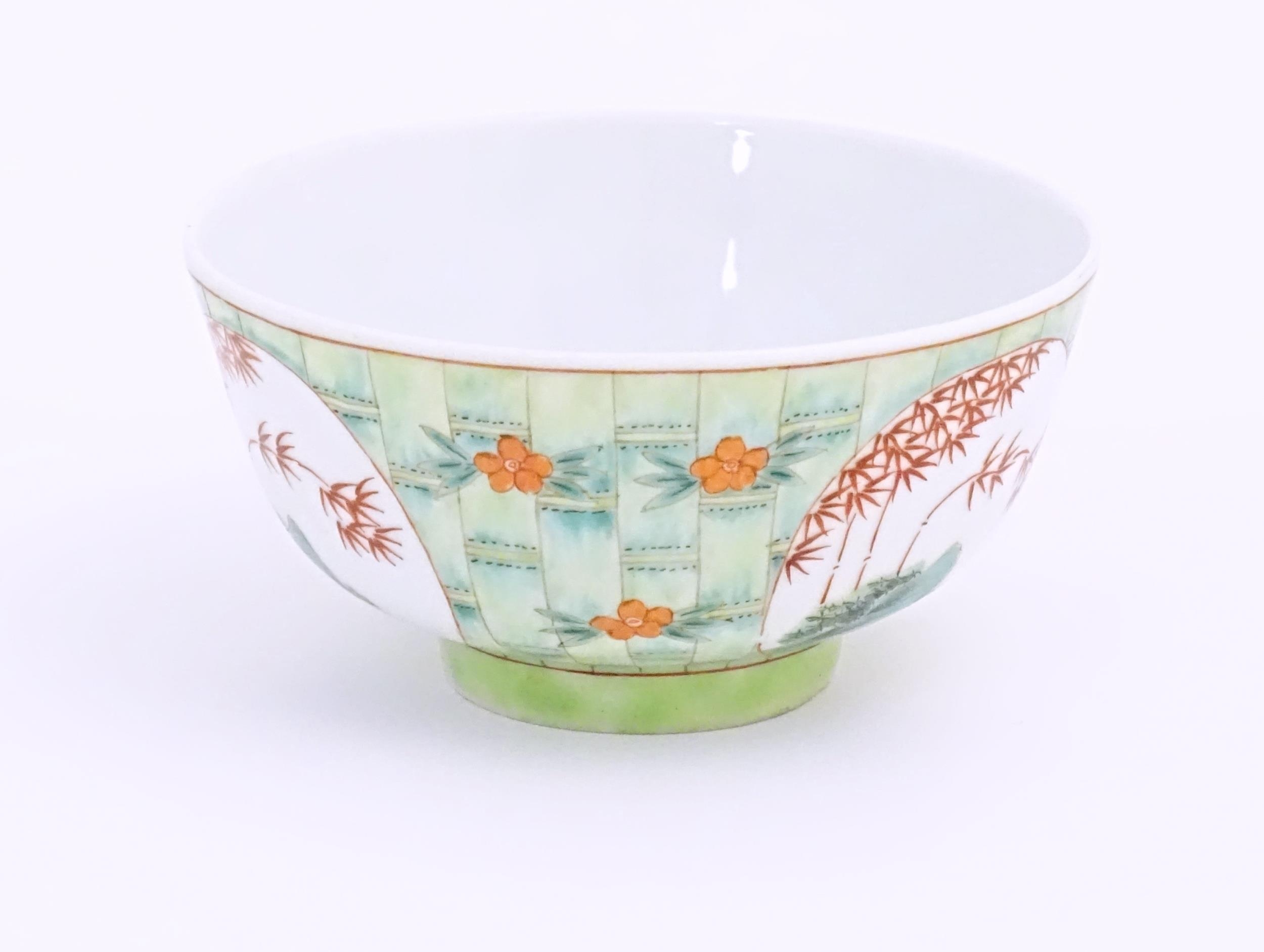 A small Chinese bowl decorated with stylised bamboo and flowers. Character marks under. Approx. 2 - Image 3 of 8