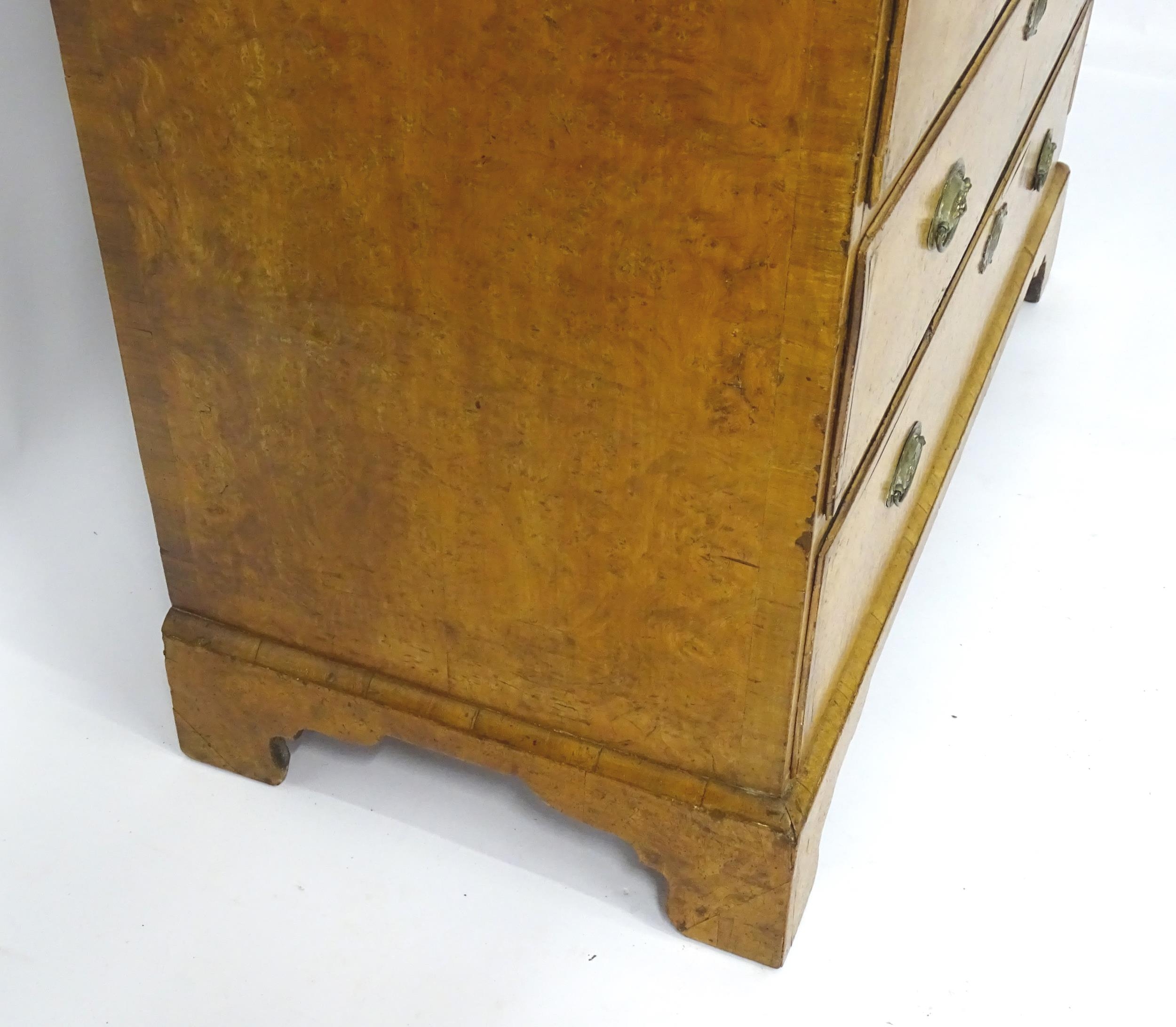 A George III walnut chest of drawers, the chest having a crossbanded top above three short over - Image 9 of 12