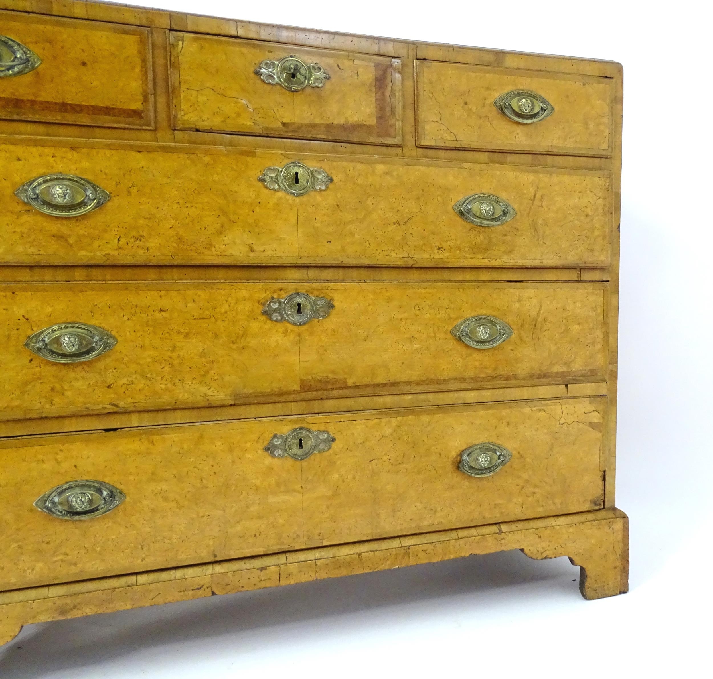 A George III walnut chest of drawers, the chest having a crossbanded top above three short over - Image 4 of 12