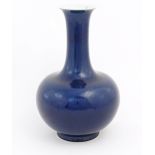 A Chinese Shangping style vase with blue ground and flared rim. Character marks under. Approx. 14