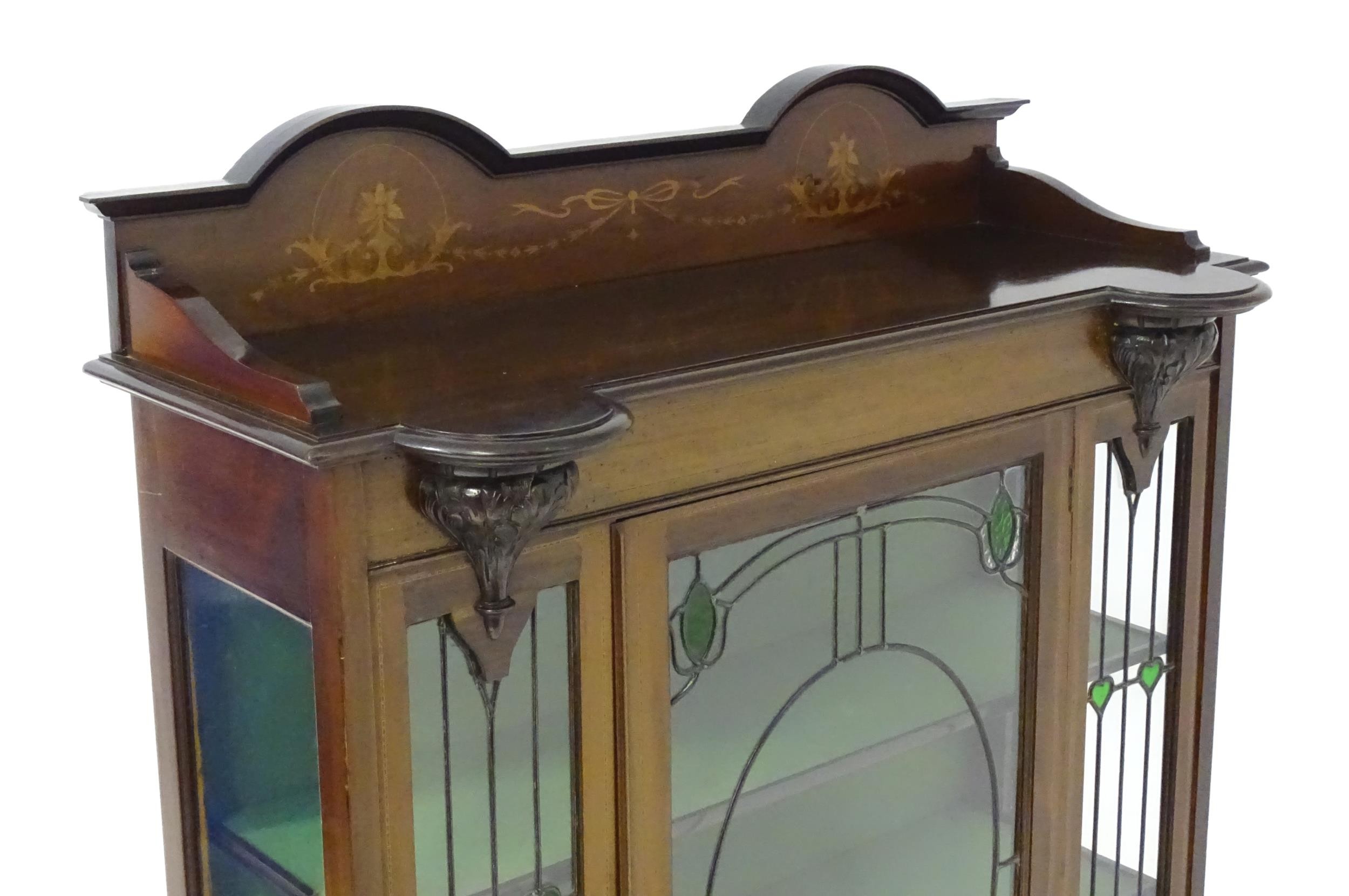 An Edwardian mahogany display cabinet with leaded glass panelling, stained glass panels and a - Image 2 of 12