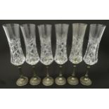 A set of six Italian cut glass champagne flutes raised on pewter stem and foot. Approx 11" high (