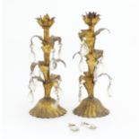 Two late 19th / early 20thC gilt metal candlestick with foliate detail and lustre drops. Approx.