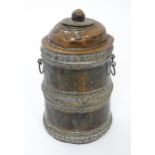 An Eastern copper lidded container of cylindrical form with twin handles, applied banded